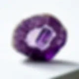 A close-up of a natural amethyst crystal showcasing its rich purple hue and internal patterns.