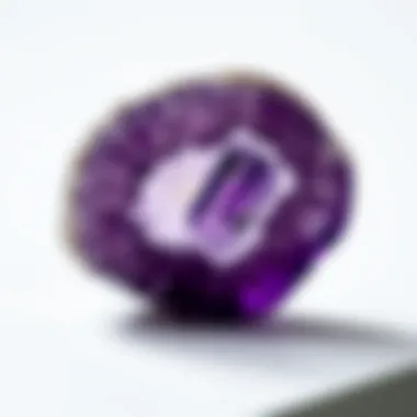 A close-up of a natural amethyst crystal showcasing its rich purple hue and internal patterns.