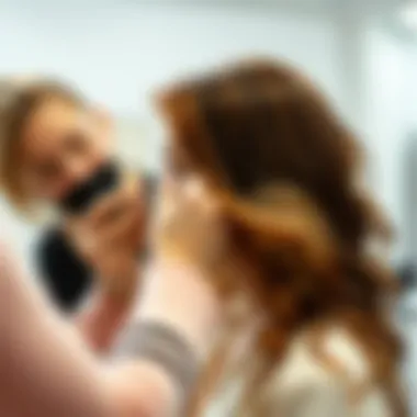 Artful Application of Warm Balayage A stylist applying a warm balayage technique to a client's hair.