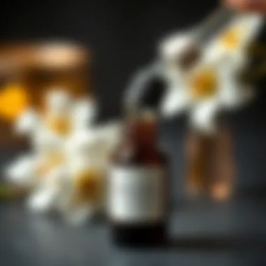 An aromatic jasmine essential oil being poured from a dropper